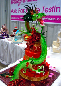 red and gold tiered wedding cake with prominent Chinese Dragon