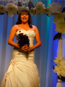 laughing bride with gorgeous, full-figured strapless dress