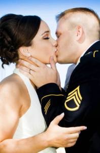 Military groom and bride kiss