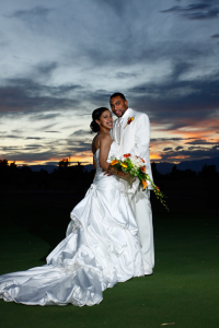bride and groom with sunset