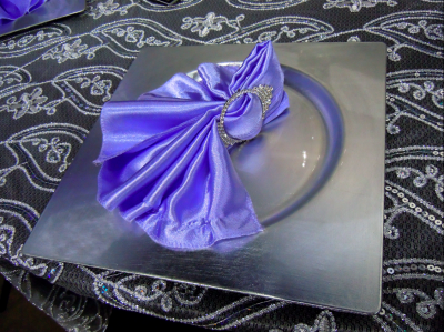 purple napkin with rhinestone ring on square, silver plate