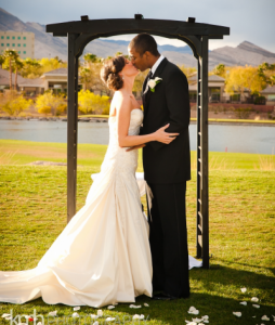 bride and groom kiss at TPC Las Vegas