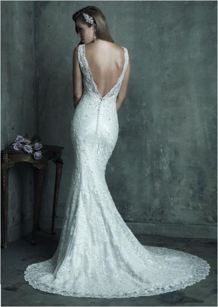 Allure Bridals fitted silhouette, v-neckline gown with plunging back and beaded overlay.