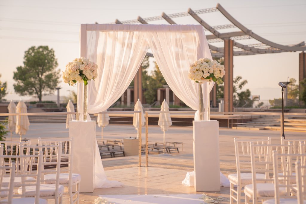 White flowers outdoor ceremony at a luxurious las vegas destination wedding.